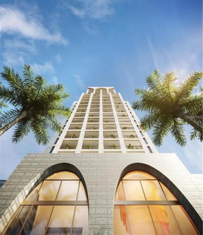 High-rise residential tower framed by palms in Tampa Bay Florida